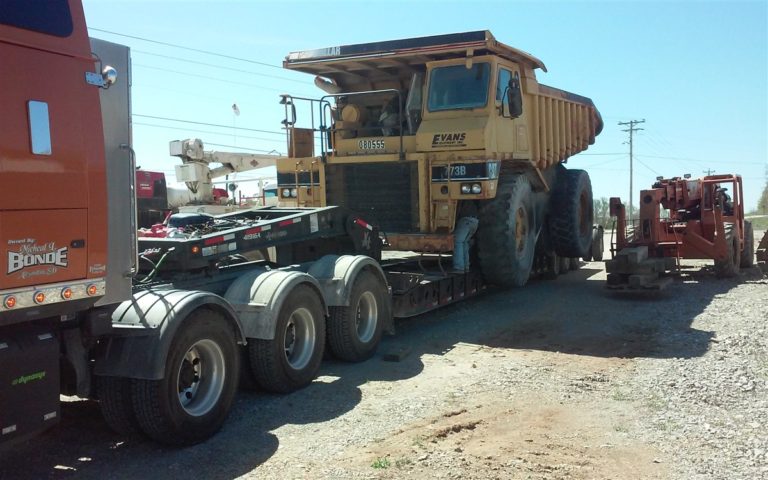 Articulated Dump Truck Hauling from Heavy Haulers