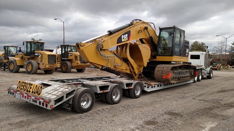 Image source: https://www.heavyhaulers.com/blog/how_to_load_an_excavator/  rubber pads