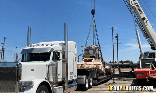 Crane lifting heavy equipment