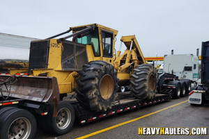 Tigercat 620C skidder transport.