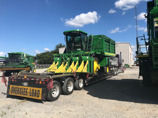 Loaded JD Cotton Picker with Heavy Haulers