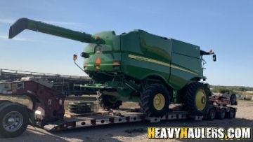 Hauling a John Deere S680 combine to Oklahoma City.