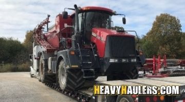 Transporting an oversize CASE IH Titan floater spreader.