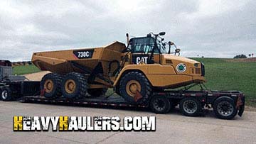 Transporting a Caterpillar 730C2 articulated dump truck.