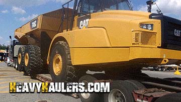 Hauling a Caterpillar 745C articulated dump truck.