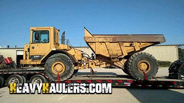  Hauling a Caterpillar D25 articulated dump truck.