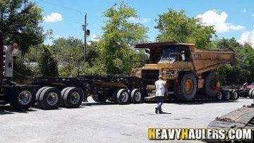 Caterpillar 773D Rock truck transported on an RGN trailer