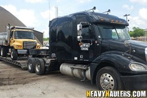 Articulated dump truck shipped on an RGN trailer.