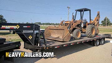 Transporting a backhoe loader.