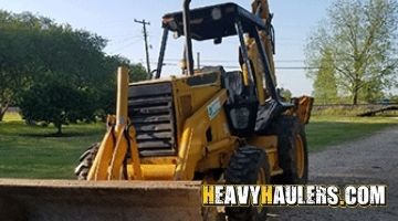  Hauling a Caterpillar backhoe loader from Maryland.