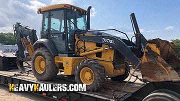 Shipping a backhoe loader on an RGN trailer.
