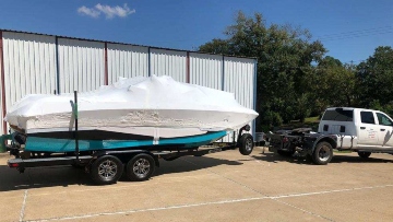 Transporting an oversize boat on a trailer.