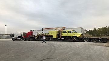 Boom truck towing load