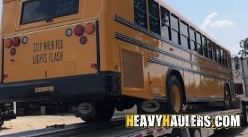 Transporting a BlueBird bus on a trailer to Alabama.
