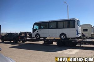 Transporting a BYD coach electric bus on a hotshot trailer.