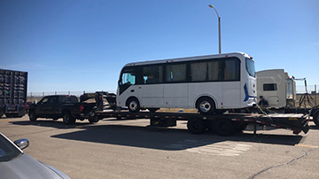 BYD C6 coach electric bus shipped on a hotshot trailer.