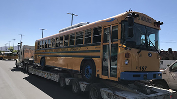 Blue Bird Electric Bus transported on an RGN trailer