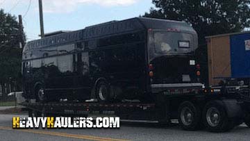 Transporting a bus on a RGN trailer.