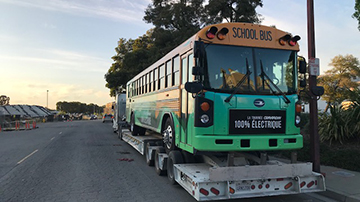 Hauling a Bluebird electric bus.