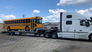 Hauling a 2019 Blue Bird T3RE Electric Bus.