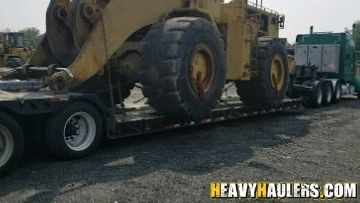 Loading a wheel loader on a trailer.