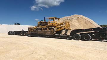 Scraper Being Transported