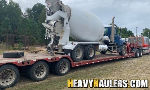 Transporting a concrete mixer truck.