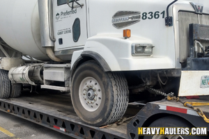 Loading a western star 4900 concrete truck on a trailer.