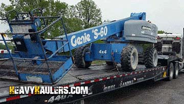 Hauling a Genie telescopic boom lift.