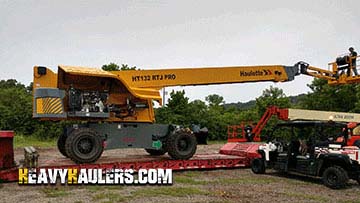 Loading a Haulotte telescopic boom lift.