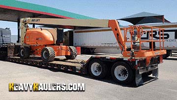 Hauling a JLG articulated boom lift.