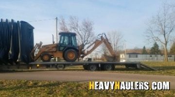 Shipping a Case 580L backhoe on a trailer.