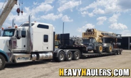 Loading a Koehring crane on a trailer.