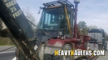 Shipping a forklift on a trailer.