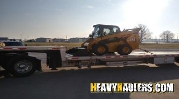Transporting a Caterpillar skid steer loader in Indiana.