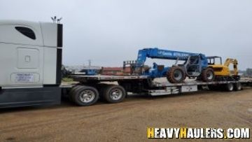 Transorting a Genie telescopic forklift from Massachusetts.