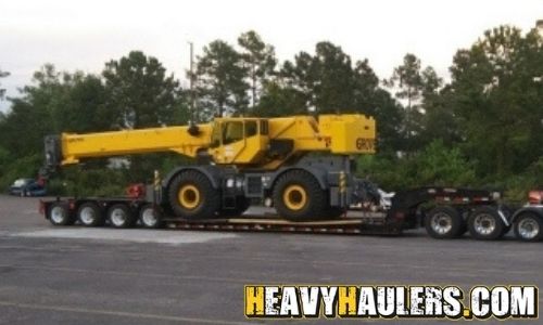 Loading a Grove crane on a trailer.