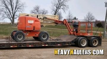 Transporting a JLG 450AJ Boom Lift.