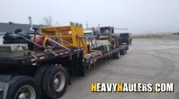 Hauling a skid loader on a trailer from New York.