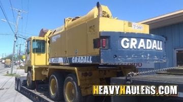 Loading a Gradall wheeled excavator on an RGN trailer.