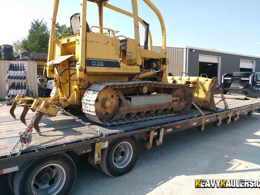 Loading a Caterpillar D3B on a trailer.