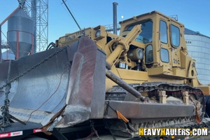 Shipping a bulldozer on a trailer.