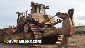 Shipping a bulldozer on a trailer.