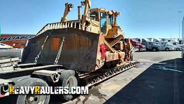 Bulldozer haul on a trailer.