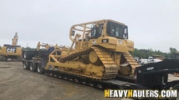 Dozer haul on an RGN trailer.