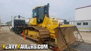 Hauling a Komatsu D61-PX23 on a Gooseneck on an 8 axle rgn