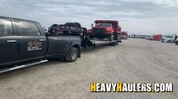 Hauling an F800 dump truck on a trailer from Illinois.