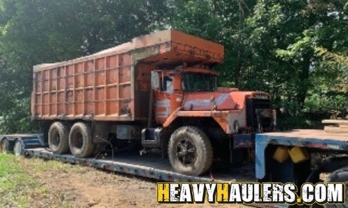 Loading a MACK dump truck on a trailer.