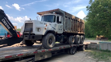 Transporting an oversize Mack dump truck.