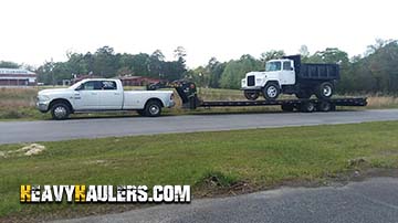 Mack truck transport on a hot shot trailer.